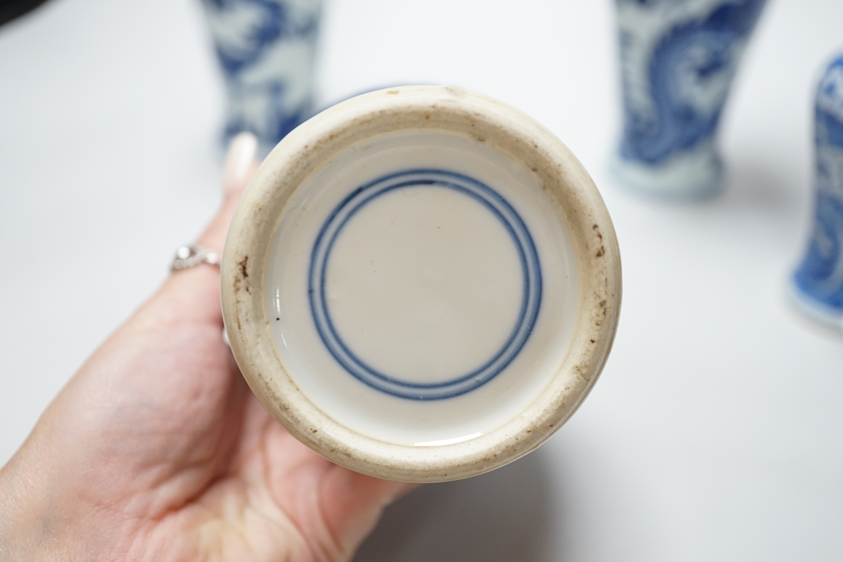 A group of Chinese blue and white ceramics including two prunus flower vases and three bowls, the largest 26cm in diameter